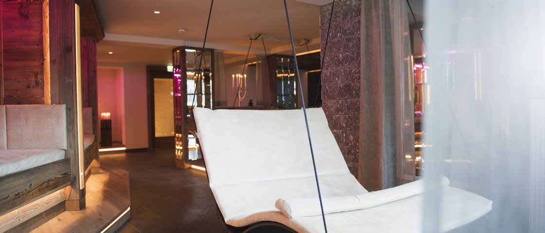 Rejuvenation at our 4-star wellness hotel in Tyrol Hanging lounge chair with white cushions in a stylish spa area