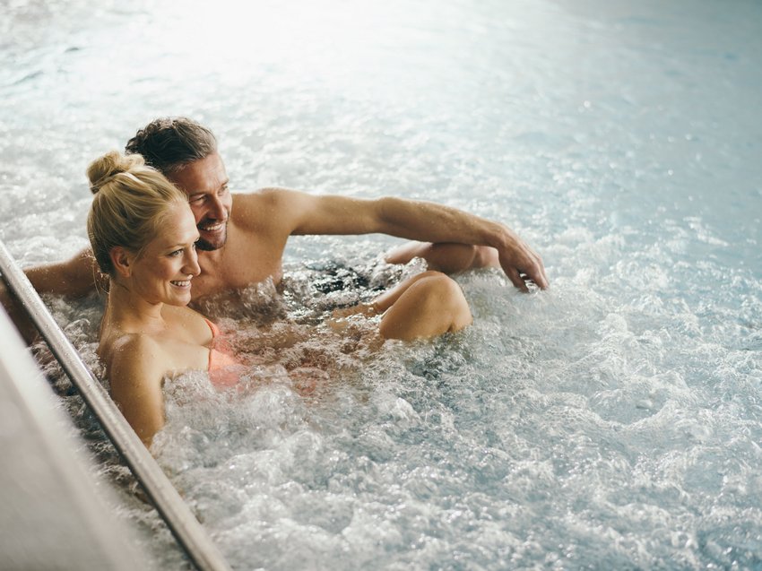 Rejuvenation at our 4-star wellness hotel in Tyrol Couple relaxing in a whirlpool with bubbling water